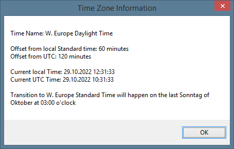 A message box displaying time zone information